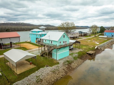 A river house with a view! This home offers 4 beds, 3 full baths on Tennessee River Golf Club in Tennessee - for sale on GolfHomes.com, golf home, golf lot