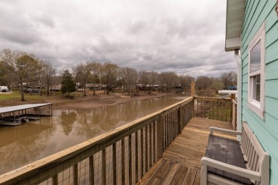 A river house with a view! This home offers 4 beds, 3 full baths on Tennessee River Golf Club in Tennessee - for sale on GolfHomes.com, golf home, golf lot