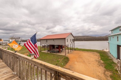 A river house with a view! This home offers 4 beds, 3 full baths on Tennessee River Golf Club in Tennessee - for sale on GolfHomes.com, golf home, golf lot