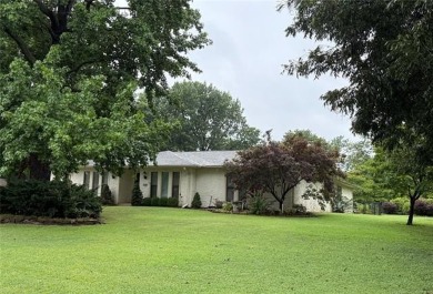 Welcome to this inviting ranch-style home nestled in a quiet on  in Oklahoma - for sale on GolfHomes.com, golf home, golf lot