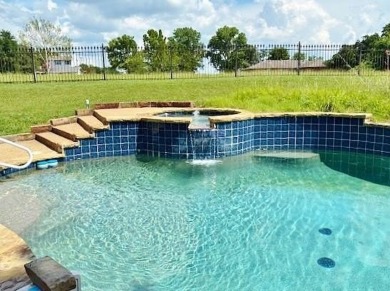 Put this custom home with a sparkling Pool and Spa at the top of on Buffalo Creek Golf Club in Texas - for sale on GolfHomes.com, golf home, golf lot