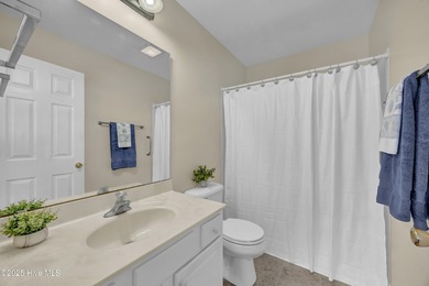 Welcome to 7809 Trap Way, a light-filled end-unit townhome in on Masonboro Country Club in North Carolina - for sale on GolfHomes.com, golf home, golf lot