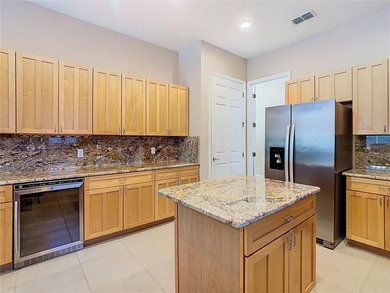 Immaculate & Well Maintained RHAPSODY model on a serene on Poinciana Golf Club in Florida - for sale on GolfHomes.com, golf home, golf lot