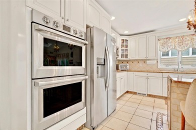 This elegant full-brick colonial sits on a prominent corner lot on Leewood Golf Club in New York - for sale on GolfHomes.com, golf home, golf lot