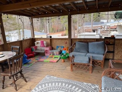 So much here for a great price! A living room and a bedroom are on River Ridge Golf Club in Virginia - for sale on GolfHomes.com, golf home, golf lot