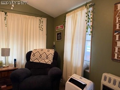 So much here for a great price! A living room and a bedroom are on River Ridge Golf Club in Virginia - for sale on GolfHomes.com, golf home, golf lot