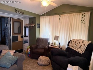 So much here for a great price! A living room and a bedroom are on River Ridge Golf Club in Virginia - for sale on GolfHomes.com, golf home, golf lot