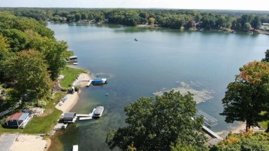 Discover your dream getaway on All Sports Lake Mecosta, part of on St. Ives Golf Club in Michigan - for sale on GolfHomes.com, golf home, golf lot