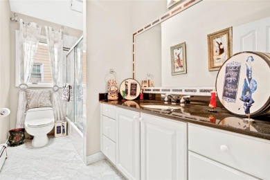 This elegant full-brick colonial sits on a prominent corner lot on Leewood Golf Club in New York - for sale on GolfHomes.com, golf home, golf lot