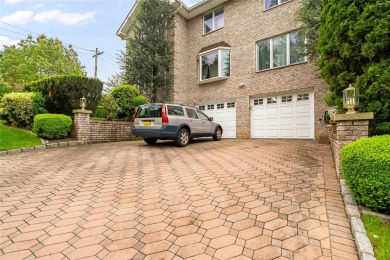 This elegant full-brick colonial sits on a prominent corner lot on Leewood Golf Club in New York - for sale on GolfHomes.com, golf home, golf lot