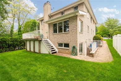 This elegant full-brick colonial sits on a prominent corner lot on Leewood Golf Club in New York - for sale on GolfHomes.com, golf home, golf lot