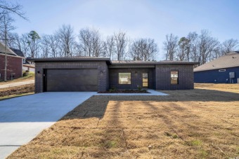 A mid-century modern styled home in a natural setting, this NEW on Diamondhead Golf and Country Club in Arkansas - for sale on GolfHomes.com, golf home, golf lot