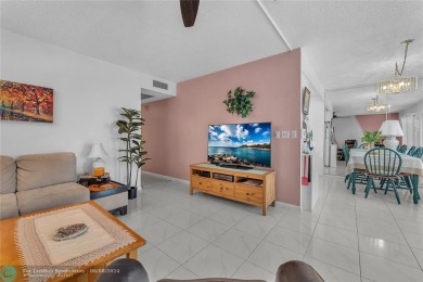 Enjoy South Florida living with this 2Bed/2Bath second floor on Hillsboro Pines Golf in Florida - for sale on GolfHomes.com, golf home, golf lot