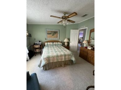 If you are looking for a home with space, then this doublewide on Anglers Green Golf Course in Florida - for sale on GolfHomes.com, golf home, golf lot