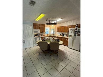 If you are looking for a home with space, then this doublewide on Anglers Green Golf Course in Florida - for sale on GolfHomes.com, golf home, golf lot