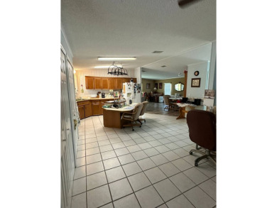 If you are looking for a home with space, then this doublewide on Anglers Green Golf Course in Florida - for sale on GolfHomes.com, golf home, golf lot