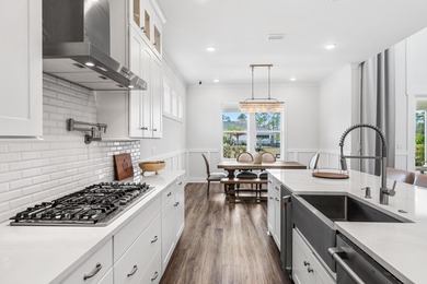 Experience the pinnacle of coastal luxury in this pristine on Origins Golf Club in Florida - for sale on GolfHomes.com, golf home, golf lot