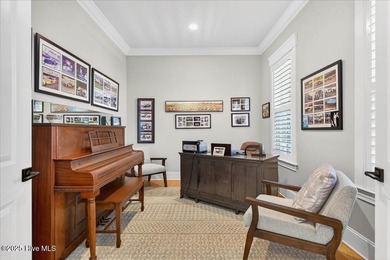 Situated within an exceptionally private cul-de-sac and embraced on Members Club At St. James Plantation in North Carolina - for sale on GolfHomes.com, golf home, golf lot