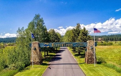Beautifully wooded, nearly 3/4 acre lot offered for sale in the on Meadowcreek Golf Resort in Idaho - for sale on GolfHomes.com, golf home, golf lot
