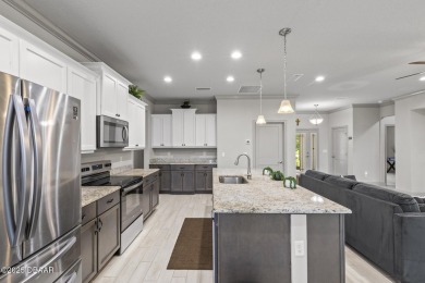 Discover this beautifully maintained 3-bedroom, 2-bathroom home on The Grand Club Cypress Course in Florida - for sale on GolfHomes.com, golf home, golf lot