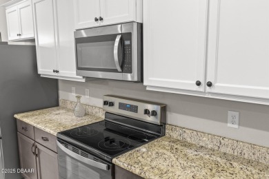 Discover this beautifully maintained 3-bedroom, 2-bathroom home on The Grand Club Cypress Course in Florida - for sale on GolfHomes.com, golf home, golf lot