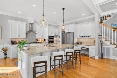 Situated within an exceptionally private cul-de-sac and embraced on Members Club At St. James Plantation in North Carolina - for sale on GolfHomes.com, golf home, golf lot