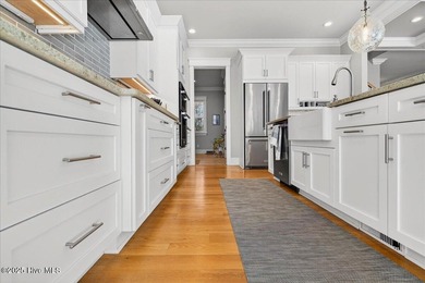 Situated within an exceptionally private cul-de-sac and embraced on Members Club At St. James Plantation in North Carolina - for sale on GolfHomes.com, golf home, golf lot