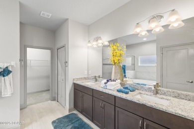 Discover this beautifully maintained 3-bedroom, 2-bathroom home on The Grand Club Cypress Course in Florida - for sale on GolfHomes.com, golf home, golf lot