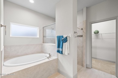 Discover this beautifully maintained 3-bedroom, 2-bathroom home on The Grand Club Cypress Course in Florida - for sale on GolfHomes.com, golf home, golf lot