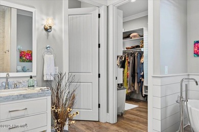 Situated within an exceptionally private cul-de-sac and embraced on Members Club At St. James Plantation in North Carolina - for sale on GolfHomes.com, golf home, golf lot