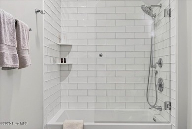 Situated within an exceptionally private cul-de-sac and embraced on Members Club At St. James Plantation in North Carolina - for sale on GolfHomes.com, golf home, golf lot