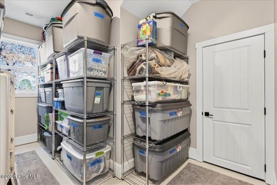 Situated within an exceptionally private cul-de-sac and embraced on Members Club At St. James Plantation in North Carolina - for sale on GolfHomes.com, golf home, golf lot