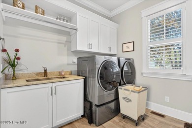 Situated within an exceptionally private cul-de-sac and embraced on Members Club At St. James Plantation in North Carolina - for sale on GolfHomes.com, golf home, golf lot