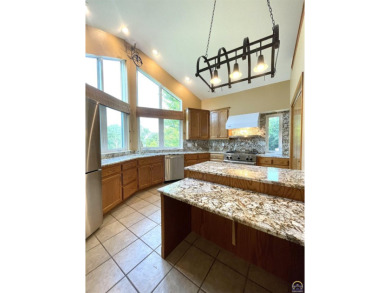 Meticulously maintained home with gorgeous lake views! Vinyl on Lake Perry Country Club in Kansas - for sale on GolfHomes.com, golf home, golf lot