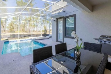 Step into luxury at this stunning 5-bedroom, 5-bath residence on National Golf Course in Florida - for sale on GolfHomes.com, golf home, golf lot