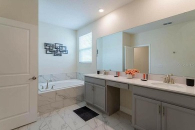 Step into luxury at this stunning 5-bedroom, 5-bath residence on National Golf Course in Florida - for sale on GolfHomes.com, golf home, golf lot