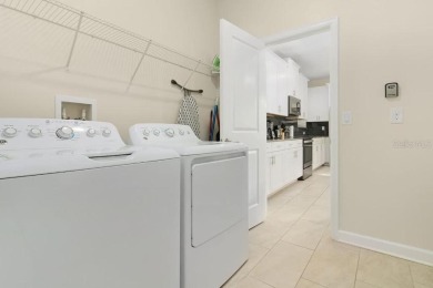 Step into luxury at this stunning 5-bedroom, 5-bath residence on National Golf Course in Florida - for sale on GolfHomes.com, golf home, golf lot