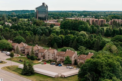 Perched above the third tee of Spruce Run Golf Course, this on Grand Traverse Resort and Spa in Michigan - for sale on GolfHomes.com, golf home, golf lot