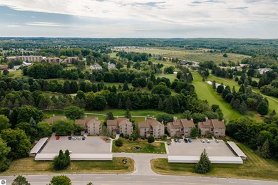 Perched above the third tee of Spruce Run Golf Course, this on Grand Traverse Resort and Spa in Michigan - for sale on GolfHomes.com, golf home, golf lot