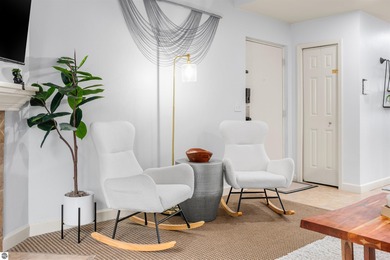 Perched above the third tee of Spruce Run Golf Course, this on Grand Traverse Resort and Spa in Michigan - for sale on GolfHomes.com, golf home, golf lot