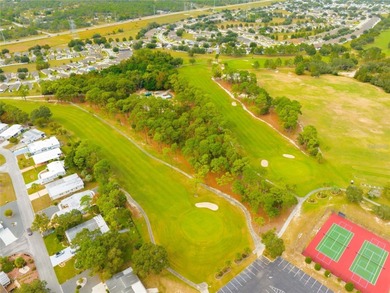Step into this furnished, move-in-ready 3BR/2BA home and feel on Brookridge Country Club in Florida - for sale on GolfHomes.com, golf home, golf lot