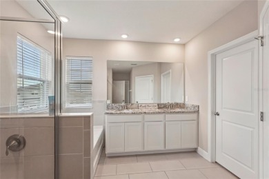 Stunning 4-Bedroom Pond View Home in Gated Star Farms at on Esplanade Golf and Country at Lakewood Ranch in Florida - for sale on GolfHomes.com, golf home, golf lot