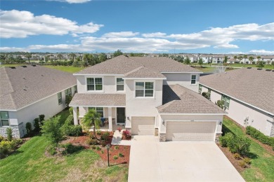 Stunning 4-Bedroom Pond View Home in Gated Star Farms at on Esplanade Golf and Country at Lakewood Ranch in Florida - for sale on GolfHomes.com, golf home, golf lot