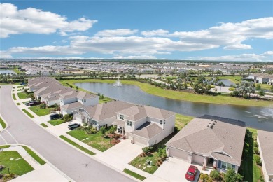 Stunning 4-Bedroom Pond View Home in Gated Star Farms at on Esplanade Golf and Country at Lakewood Ranch in Florida - for sale on GolfHomes.com, golf home, golf lot