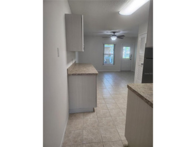 GROUND FLOOR 2 bedroom/2 bath condo on WEST side of Belcher that on On Top Of The World Golf Course in Florida - for sale on GolfHomes.com, golf home, golf lot