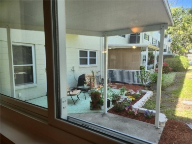 GROUND FLOOR 2 bedroom/2 bath condo on WEST side of Belcher that on On Top Of The World Golf Course in Florida - for sale on GolfHomes.com, golf home, golf lot