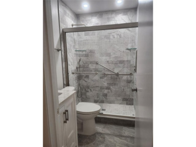 GROUND FLOOR 2 bedroom/2 bath condo on WEST side of Belcher that on On Top Of The World Golf Course in Florida - for sale on GolfHomes.com, golf home, golf lot