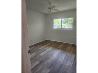 GROUND FLOOR 2 bedroom/2 bath condo on WEST side of Belcher that on On Top Of The World Golf Course in Florida - for sale on GolfHomes.com, golf home, golf lot