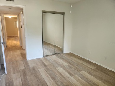 GROUND FLOOR 2 bedroom/2 bath condo on WEST side of Belcher that on On Top Of The World Golf Course in Florida - for sale on GolfHomes.com, golf home, golf lot