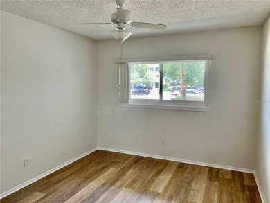 GROUND FLOOR 2 bedroom/2 bath condo on WEST side of Belcher that on On Top Of The World Golf Course in Florida - for sale on GolfHomes.com, golf home, golf lot